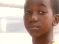 Sad boy crying and turning away