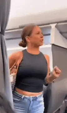 Woman on plane says that motherfucker back there is not real
