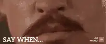 Close up of mustache lips saying when