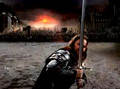 Boromir raises sword before army