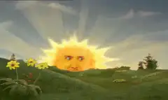 Sun rising over green hills