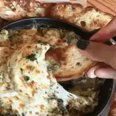 Cheesy spinach dip cheese pull