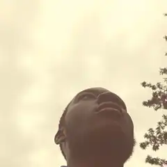 man looking up at sky