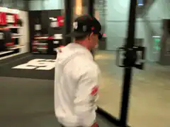 Man crashes through glass door