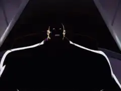 Bane turns from shadow to menacing grin