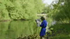 Woman falls into river while reading