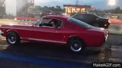 Red Mustang doing a burnout