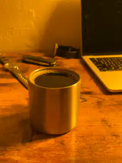 steaming coffee mug on desk