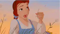 Belle blows dandelion seeds