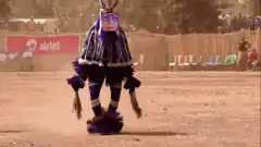 person in purple costume dancing