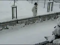 Snowman waves at passerby