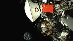 Chinese flag on lunar lander with Earth in background