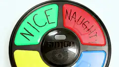 Hand pressing Simon game buttons