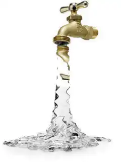 Golden faucet pouring water