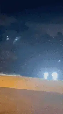 car drifting on a hill at night