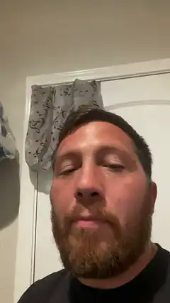 Man with closed eyes and beard