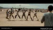 Adam Sandler watching prisoners dance