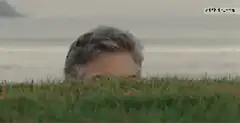George Clooney rising from grass