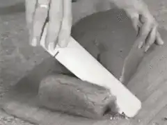 slicing a loaf of bread