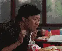 Ken Jeong eating and laughing