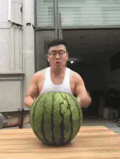 Man cuts watermelon with wire cutter