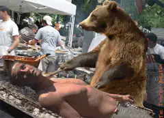 bear grilling a man