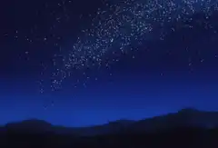 Starry night sky over mountains