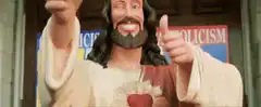 Jesus statue pointing and thumbs up