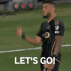 Soccer player celebrating with finger guns
