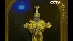Dancer in golden thousand-armed costume