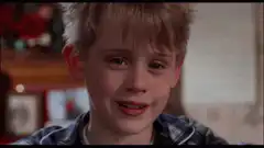 Macaulay Culkin smirking