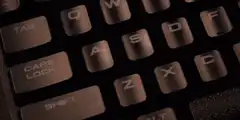 Finger presses keyboard keys with RGB lighting