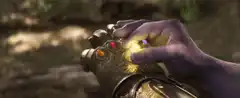 Thanos snaps his fingers with the Infinity Gauntlet