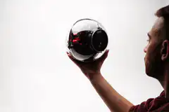 Man holding crypto orb turns into bitcoin