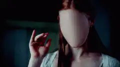 faceless woman raises hand