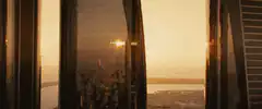Red car falling between skyscrapers