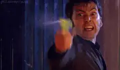 David Tennant as the Doctor with a water pistol