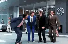 Four men jumping in celebration
