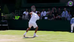 Tennis player serves at Wimbledon