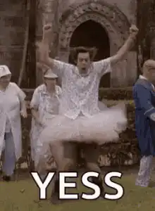 Man in tutu jumping with YESS text