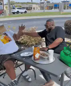 Man falls off chair while eating