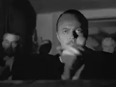 Orson Welles pointing and clapping