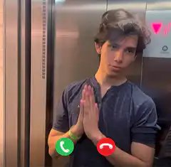 Man in elevator praying for call answer