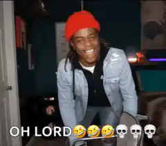 Man in red beanie laughing and falling back