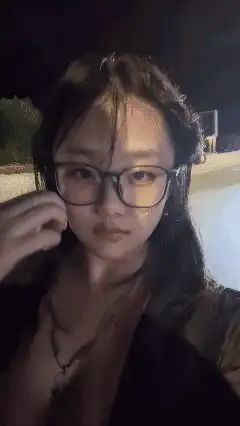 Girl with glasses looking at camera