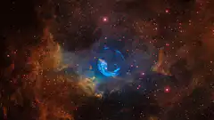 Blue planet in colorful nebula