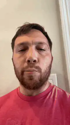 Man with pink lipstick smacking lips