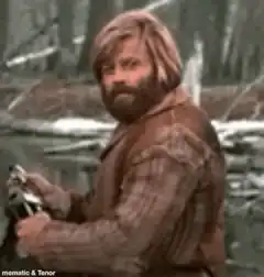 Zach Galifianakis turns and smirks
