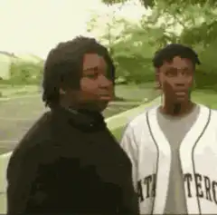 Two men talking outside