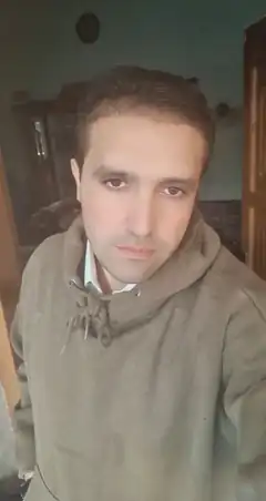 Man in hoodie looking at camera